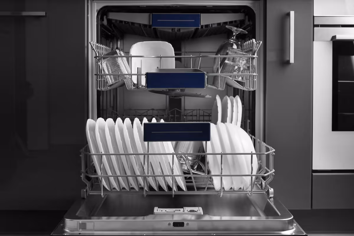 Featured Blog: A woman looking at a dishwasher