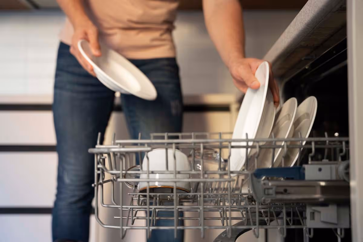 Featured Blog: A woman looking at a dishwasher