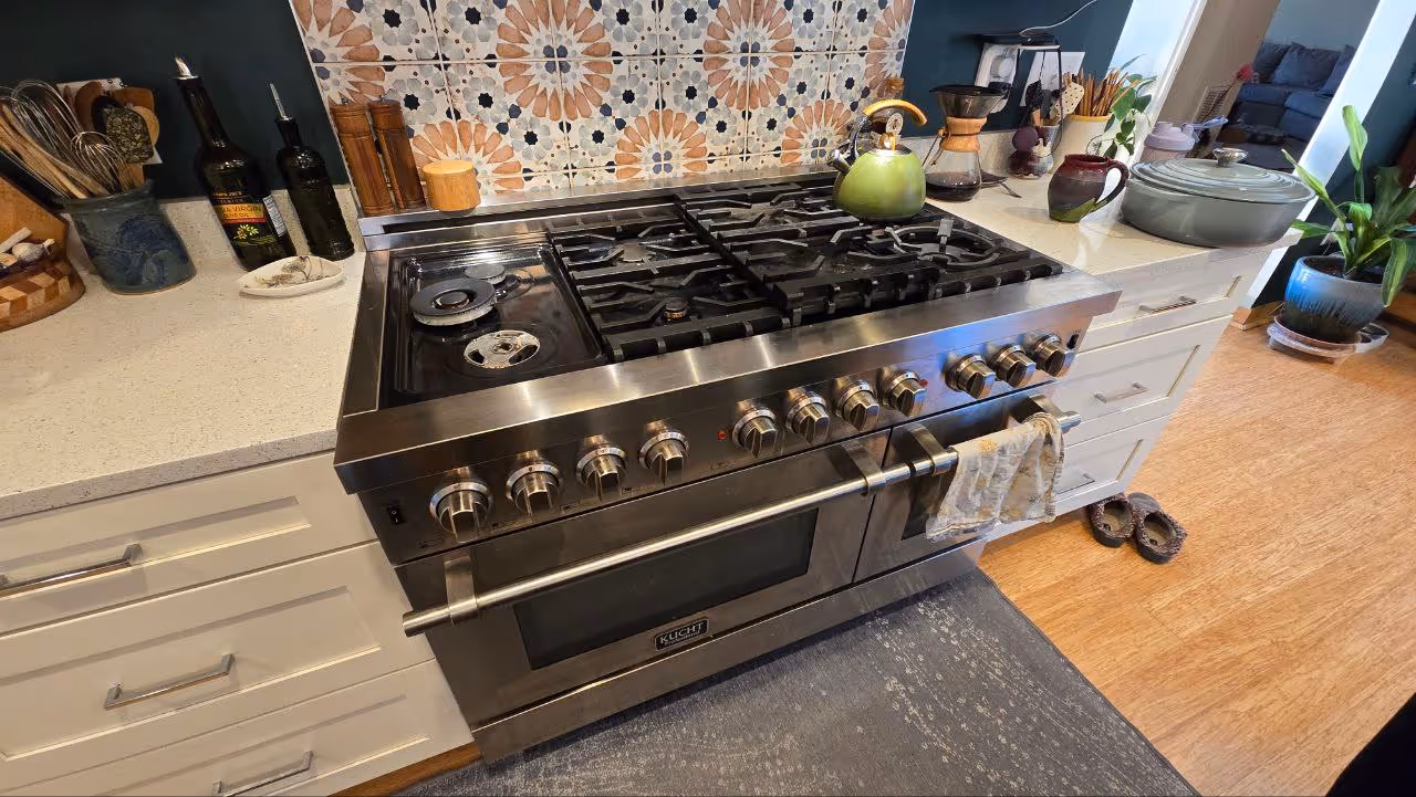Featured Blog: A woman looking at a dishwasher