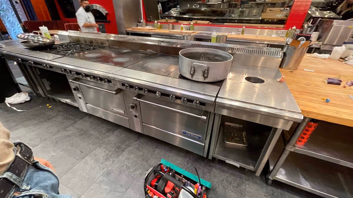 Featured Blog: A woman looking at a dishwasher