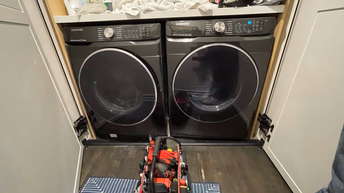 Featured Blog: A woman looking at a dishwasher