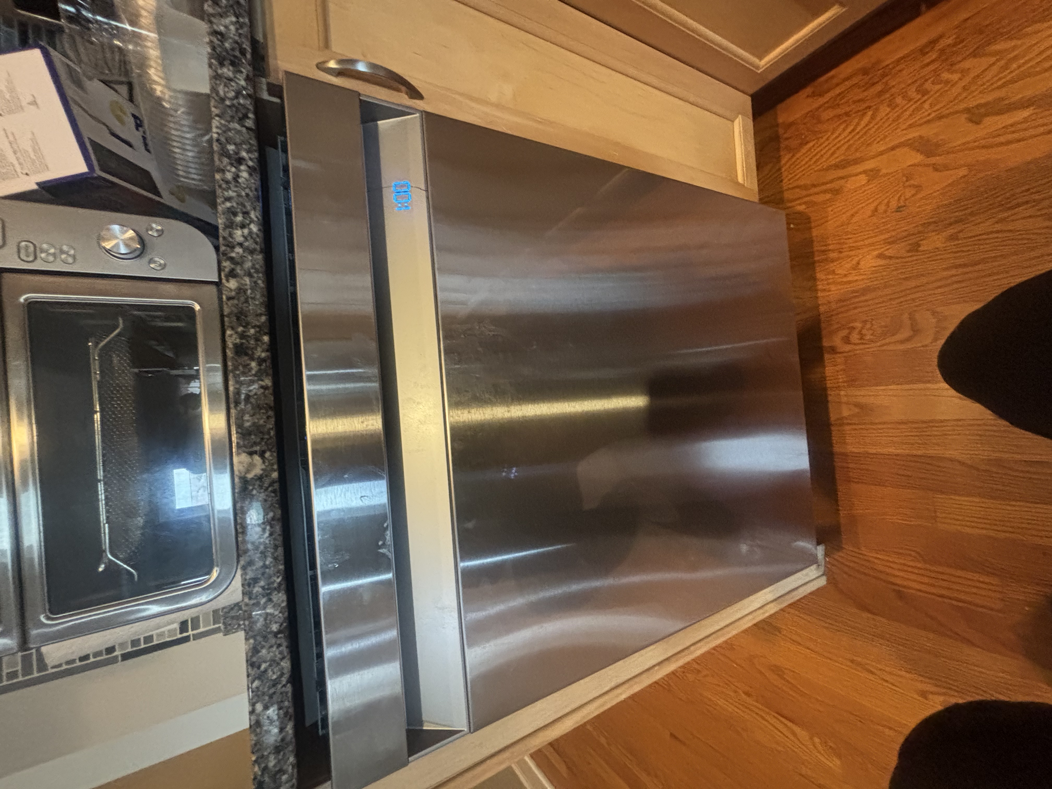 Featured Blog: A woman looking at a dishwasher