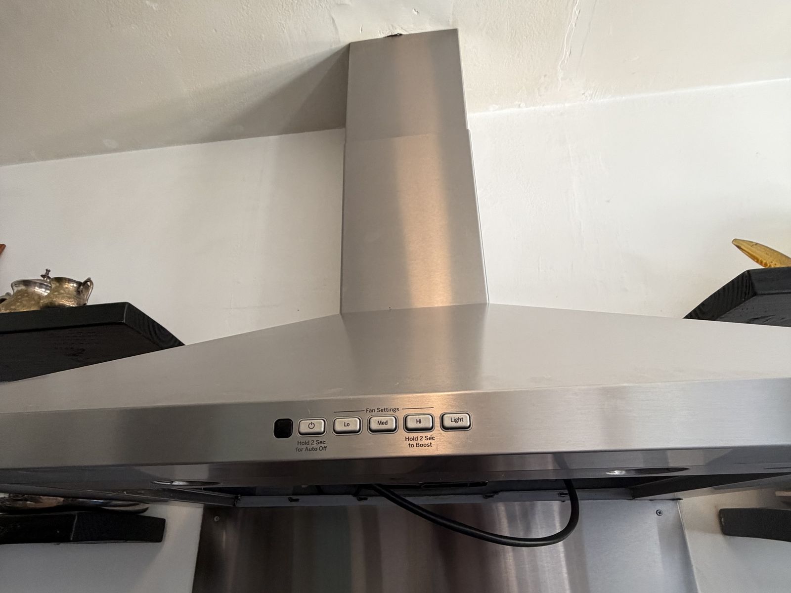 Featured Blog: A woman looking at a dishwasher